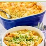 Cheesy hashbrown casserole with cornflakes serving in a white bowl in front of the dish.