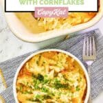 Overhead view of cheesy hashbrown casserole with cornflakes in a bowl and baking dish.
