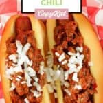 Homemade James Coney Island chili and chopped onions on top of two hot dogs.