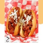 Homemade James Coney Island chili on hot dogs in a serving basket.
