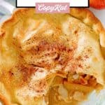 Double crust old fashioned apple pie in a glass pie plate.