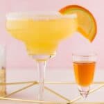 Closeup of a homemade Olive Garden Italian margarita and a shot of amaretto.