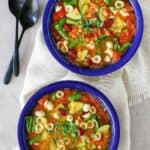 Overhead view of two bowls of copycat Olive Garden minestrone soup.