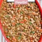 Overhead view of copycat Pappasito's charro beans in a large serving dish.