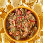Overhead view of copycat Pappasito's salsa and tortilla chips around it.