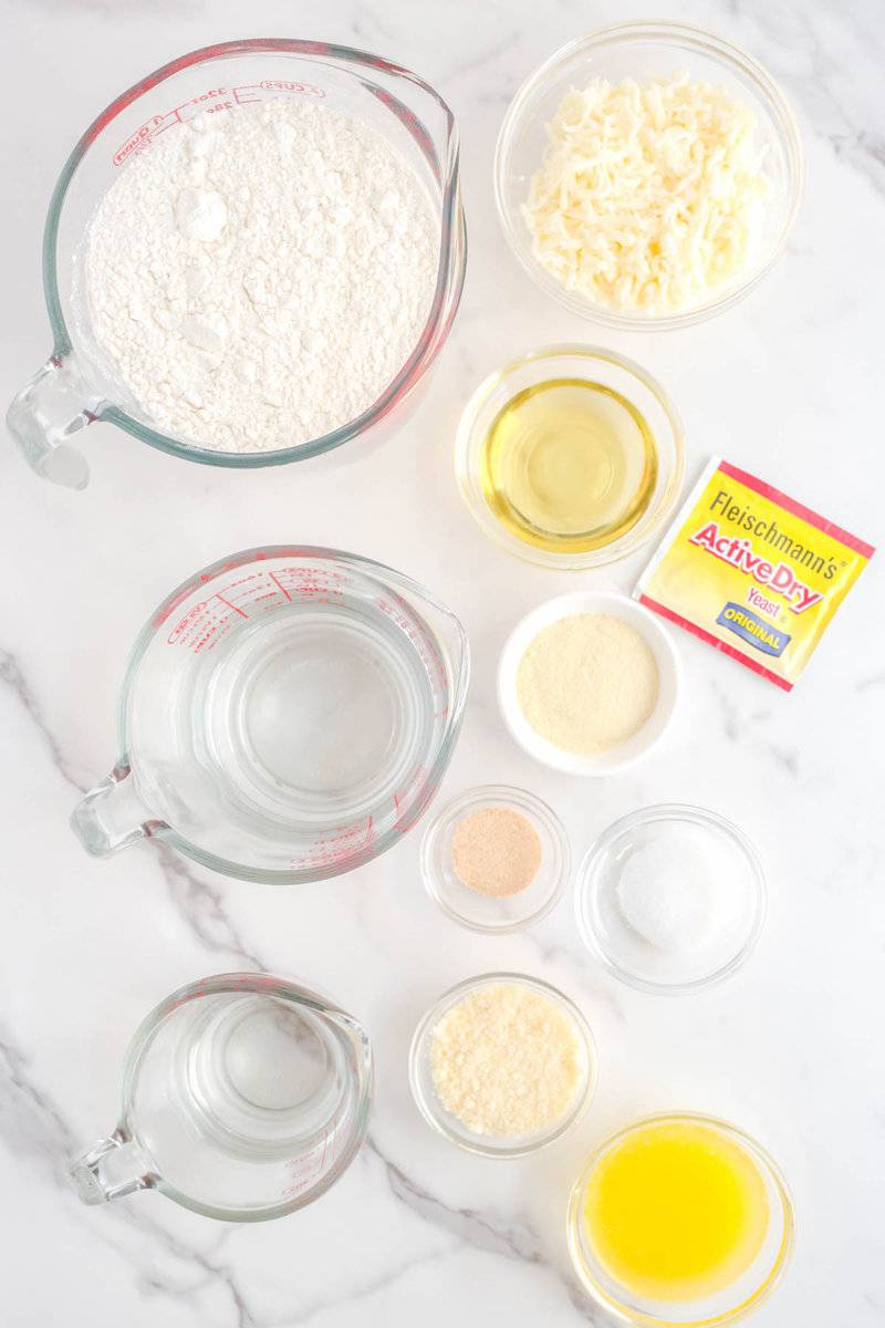 Copycat Pizza Hut cheese sticks ingredients on a marble surface.