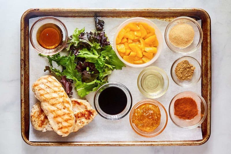 Copycat TGI Friday's mandarin orange salad ingredients on a tray.