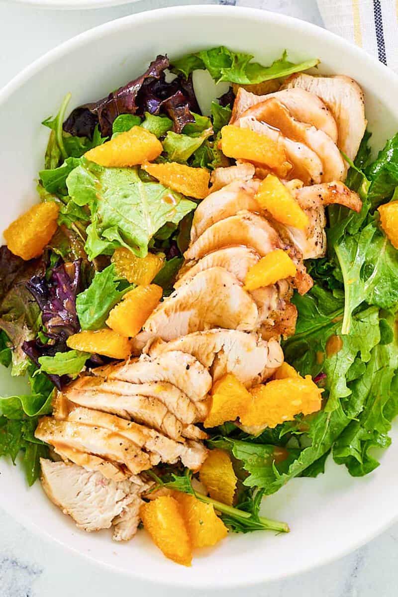 Overhead view of copycat TGI Friday's mandarin orange salad with chicken.