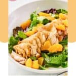 Homemade TGI Friday's mandarin orange salad with chicken in a white bowl.