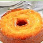 Glazed Bacardi rum cake and forks behind it.