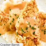Homemade Cracker Barrel fried chicken tenders and gravy on mashed potatoes.
