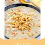 A bowl of creamy turkey soup with cornbread crumbles on top.
