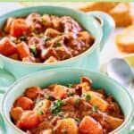 Two soup crocks filled with crockpot beef stew.