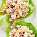 Fruity chicken salad on butter lettuce leaves.