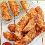 Homemade jojo potato wedges in a serving basket and on a wire racke.