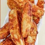 Homemade jojo potato wedges on parchment paper.