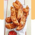 Homemade jojo potato wedges in a basket and a cup of ketchup.