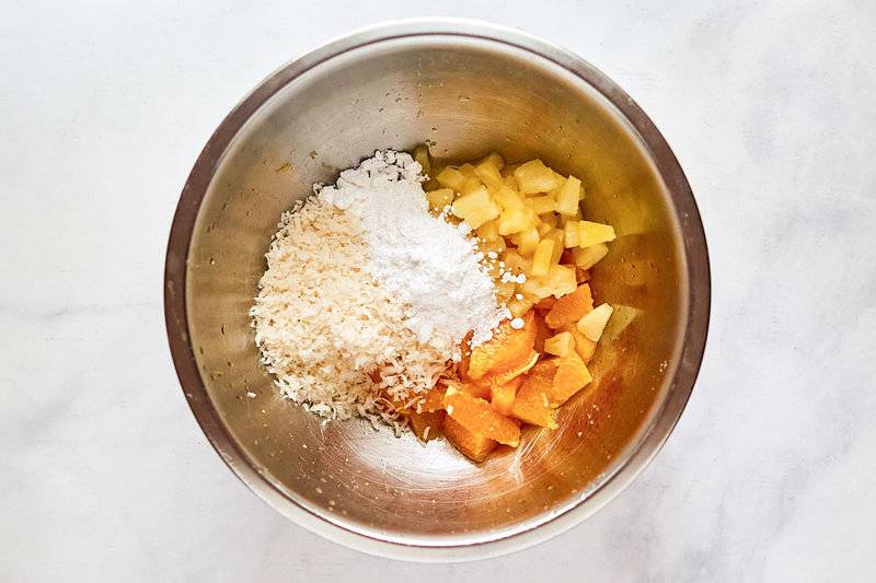 Copycat Luby's ambrosia salad ingredients in a mixing bowl.