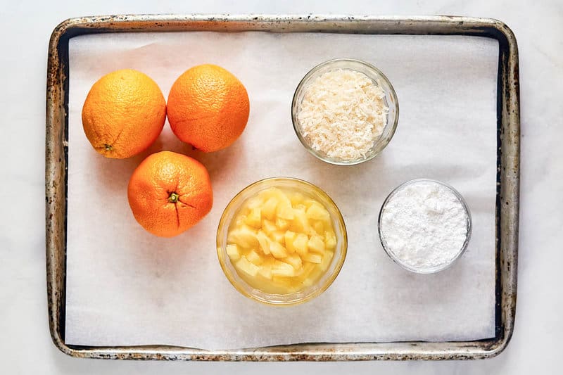 Copycat Luby's Ambrosia fruit salad ingredients on a tray.