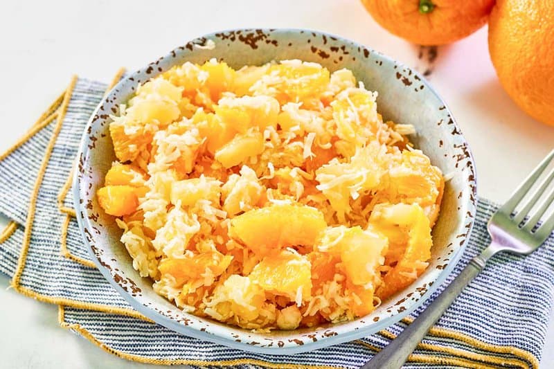 Copycat Luby's ambrosia fruit salad and a fork next to it.