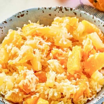 Copycat Luby's Ambrosia fruit salad in a bowl.