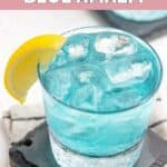 Homemade Olive Garden Blue Amalfi drink garnished with a lemon wedge.