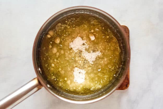 Flour and melted butter in a saucepan.