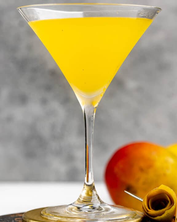 Copycat Olive Garden mango martini and a mango.