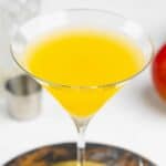 Homemade Olive Garden mango martini on top of a coaster.