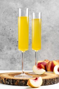 Two copycat Olive Garden peach bellini drinks.