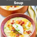A bowl of homemade Panera baked potato soup topped with cheese, bacon, and sour cream.