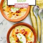 Homemade Panera baked potato soup in bowls and spoons next to them.