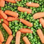 Buttery green peas and baby carrots.