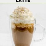 Homemade Starbucks pumpkin spice latte in a mug on a coaster.