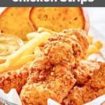 Homemade Whataburger chicken strips with fries, toast, and dipping sauce in a basket.