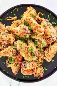Copycat Anthony's coal fired wings on a large plate.