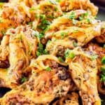 Homemade Anthony's coal fired chicken wings piled on a plate.