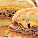 Homemade Arby's beef and cheddar cut in half.