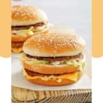 Homemade McDonald's big mac burgers on a wood board.