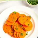 Sliced boiled carrots on a plate.
