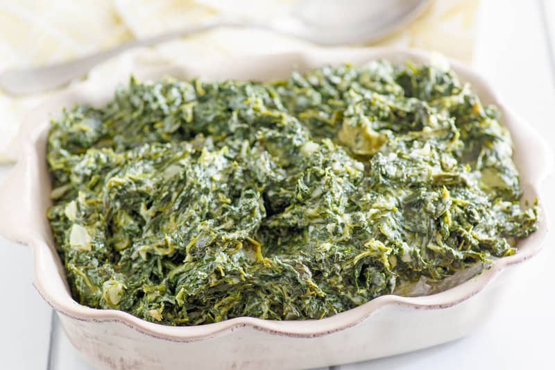 Copycat Boston Market creamed spinach in a casserole dish.