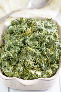 Copycat Boston Market creamed spinach in a baking dish.