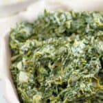 Homemade Boston Market creamed spinach in a baking dish.