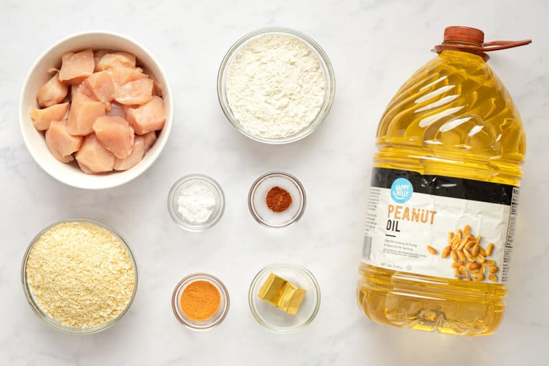 Copycat Chick Fil A chicken nuggets ingredients on a marble surface.