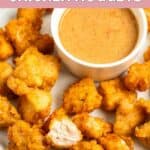 Homemade Chick Fil A chicken nuggets and dipping sauce on a plate.