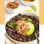 A bowl of homemade Chili's black beans and a small bowl of pico de gallo.