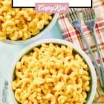 Homemade Cracker Barrel mac and cheese in two bowls and two forks beside them.