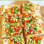 Eight crescent roll veggie pizza slices on a pizza peel.