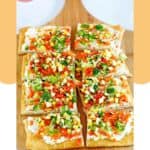 Crescent roll veggie pizza slices on a pizza peel.