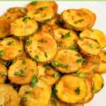 Fried zucchini on a large plate.